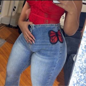 High Rise Blue Jeans with Red Butterfly Accent